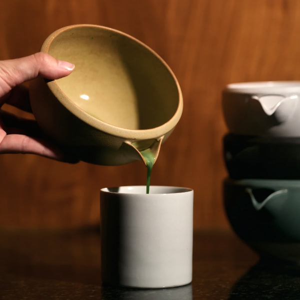 Pouring matcha from the Origami Katakuchi Matcha Bowl in Wara Ochre